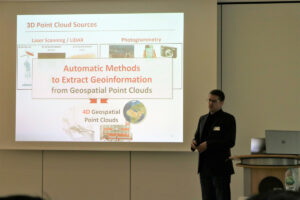 Prof. Bernhard Höfle giving a presentation how to benefit from 3D geographic point clouds to reduce emissions.